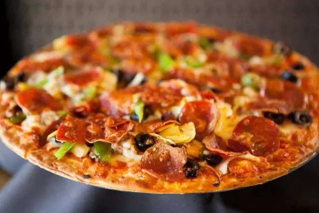 Pizza with assorted toppings at Vito's